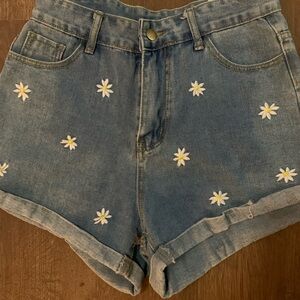 Adorable denim shorts with daisys.